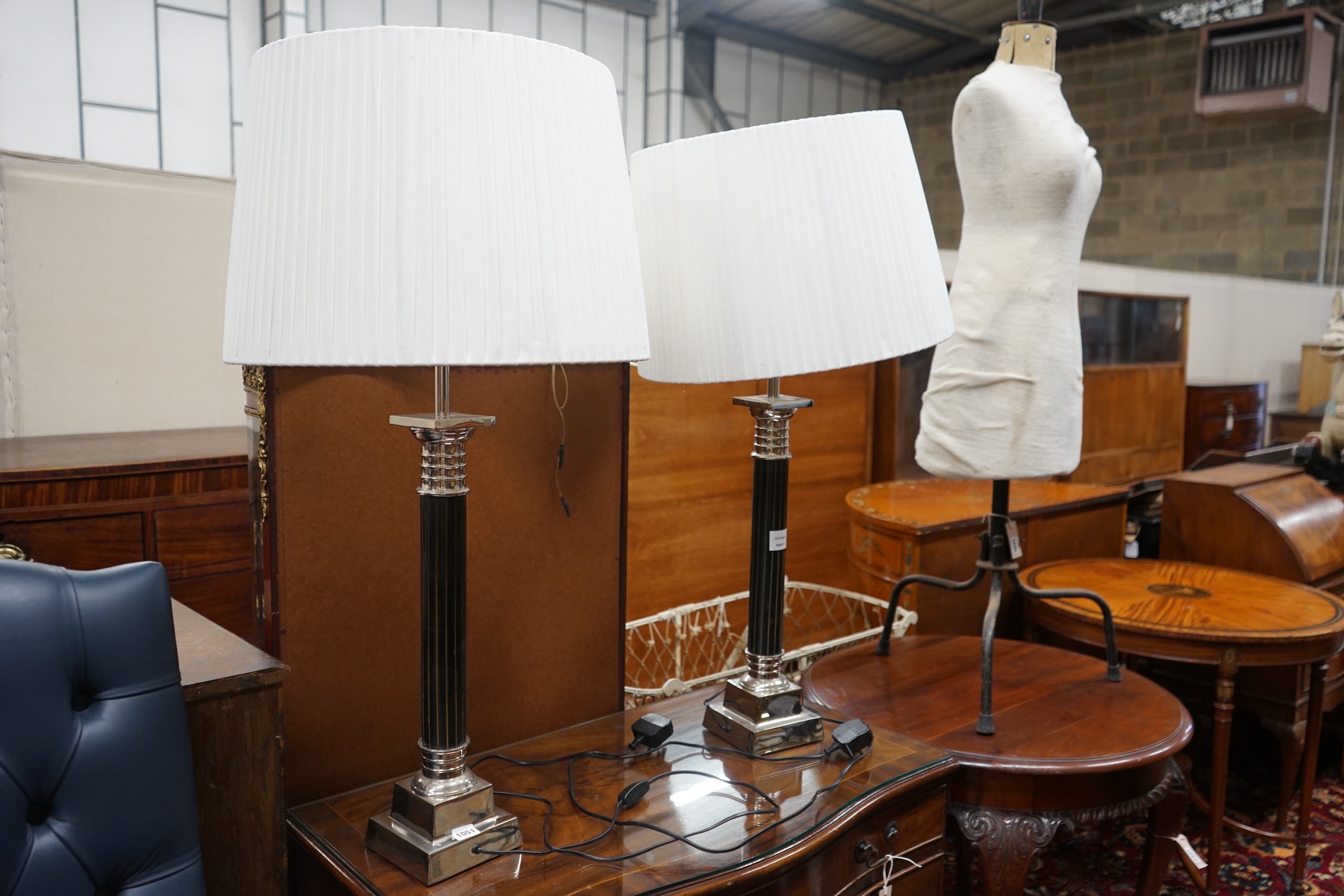 A pair of Oka gilt metal mounted and black lacquer table lamps and shades, height with shades 97cm